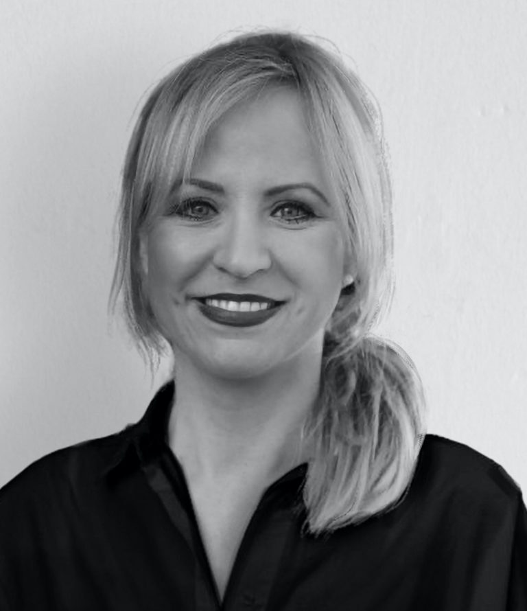 Sarah Dicks is smiling at the camera.