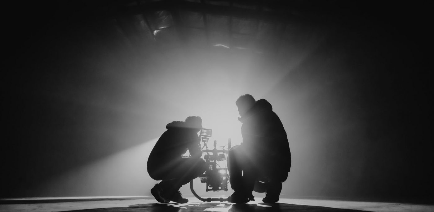 Two people filming in a film studio